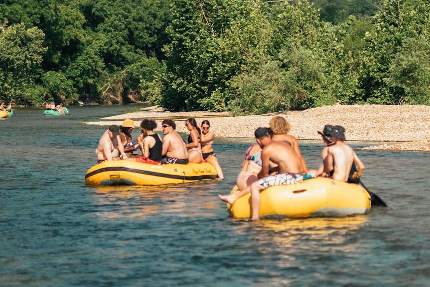 two groups of rafters take a leisurely float on the Elk River, River Ranch Resort Noel, Missouri