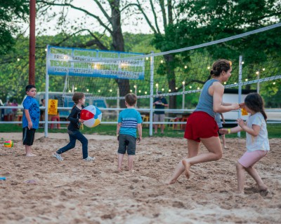 young children play sand volleyball with a beach ballRiver Ranch Resort Noel, Missouri