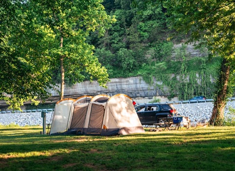large tent set up along Elk River and Sycamore Landing at River Ranch Resort in Noel, Missouri