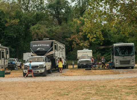 several campers set up tents and RVs at campsite near River Ranch Resort in Noel, Missouri