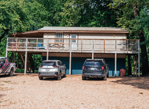 outdoor and wrap around porch view of sycamore cabin for rent near River Ranch Resort Noel, Missouri